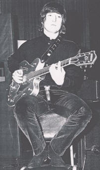 John Lennon With His Gretsch Nashville Model Guitar